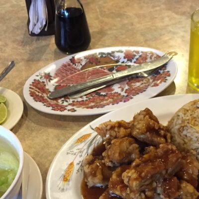 A typical chifa meal of “Chi Jau Kay”. The "chi jau" sauce with chicken is unique to Peruvian chifa.