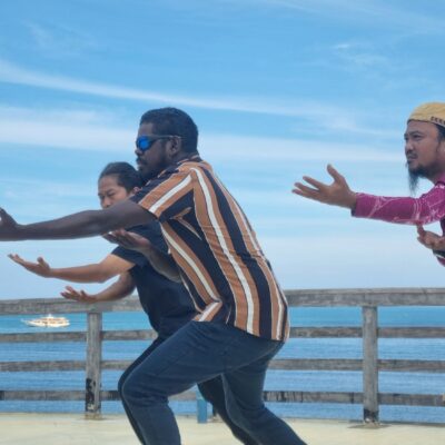 Abdi Karya, David Yunupiŋu and Guswan Gunawan dancing in Tanah Beru, Bulukumba Regency, July 2025. Photo: James Pilbrow.