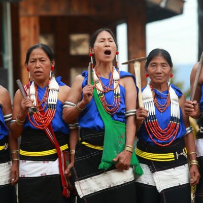 A group of women in traditional dress singing in Nagaland.