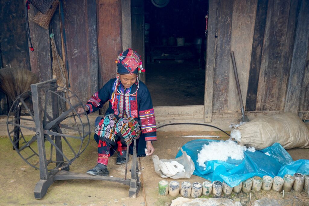 Oma spinning cotton. 6 January 2021. Used with permission from the Traditional Arts and Ethnology Centre, Laos.