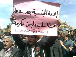 Kurdish protest in Qamishli, April 2011. Banner reads ‘Returning Nationality After 50 Years of Deprivation is not a Gesture of Generosity’. Source: Welatê me, reproduced with permission.