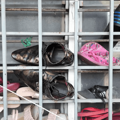 Shoes behind window bars, Malaysia. Photo used with permission of Zoe Bell/CEVAW.