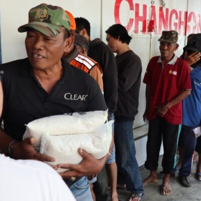 People line up to receive rice from a food assistance program, Pekalongan, Indonesia, March 2026.