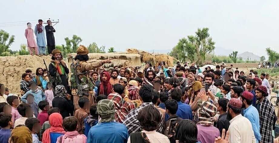 A Baluch fighter talking to villagers in Baluchistan province, Pakistan, 2026