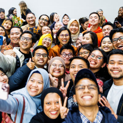 Sri Mulyani Indrawati surrounded by students taking selfies, August 2026.